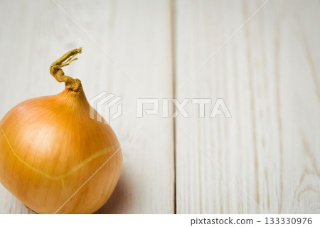 Fresh onion on wooden table 133330976