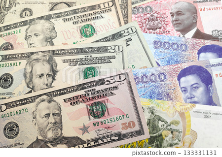 Stack of US Dollar and Cambodian rie 133331131
