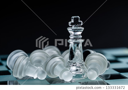 glass chess board game in black background ,selective focus on King, winner concept glass chess board game in black background ,selective focus on King, winner concept 133331672