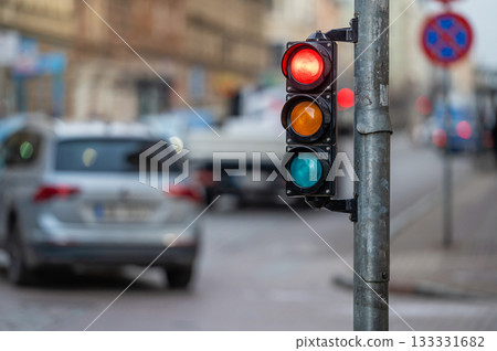 traffic light on the street junction with beautiful bokeh, city with cars in the background 133331682