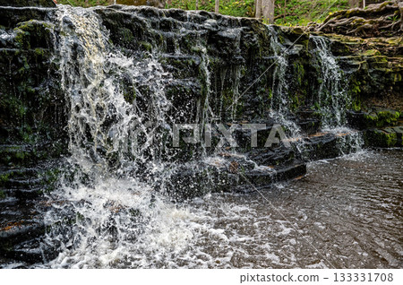 beautiful view in spring of a waterfall on small river Ivande in Latvia beautiful view in spring of a waterfall on small river Ivande in Latvia 133331708
