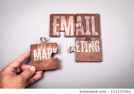 Hand Completing Puzzle with Words Email Marketing Representing Digital Communication and Business Hand Completing Puzzle with Words Email Marketing Representing Digital Communication and Business 133331983