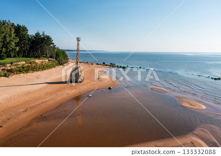 old ruins of Kurmrags Lighthouse on the shore of the Rigas Gulf, Baltic sea, Latvia old ruins of Kurmrags Lighthouse on the shore of the Rigas Gulf, Baltic sea, Latvia 133332088