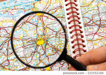 map of Bruxelles in Belgium through magnifying glass, travel destination concept 133332100
