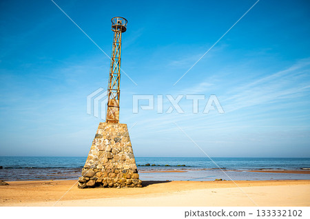 abandoned ruins of Kurmrags Lighthouse on the shore of the Rigas Gulf, Baltic sea, Latvia abandoned ruins of Kurmrags Lighthouse on the shore of the Rigas Gulf, Baltic sea, Latvia 133332102