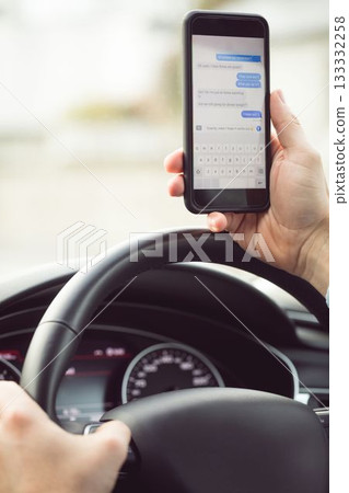 Man driver using smart phone in car, Write message Man driver using smart phone in car, Write message 133332258