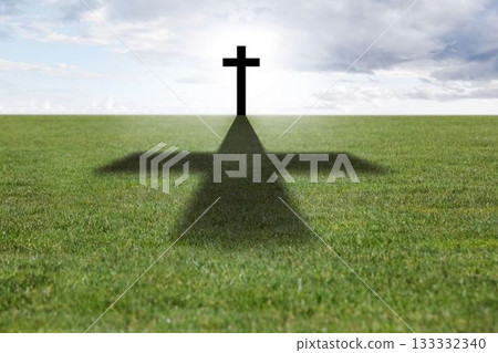Flat design is showing dark cross standing on grass field under partly cloudy sky, casting shadow 133332340