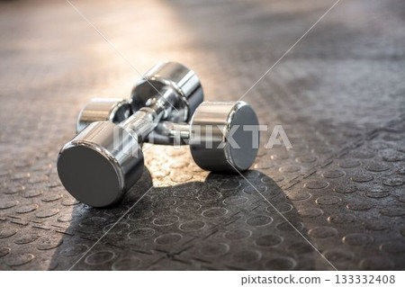 Dumbbells on floor at gym Dumbbells on floor at gym 133332408