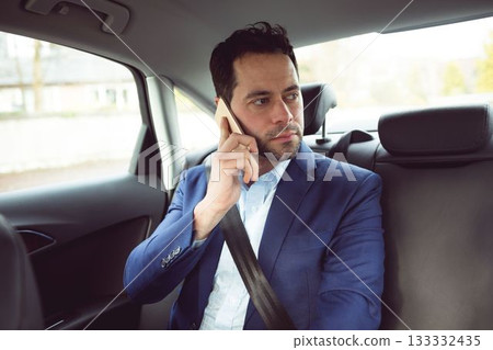 Businessman call in a car 133332435