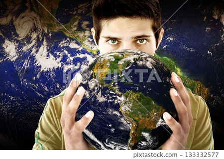 Adult male is holding realistic globe with Americas and clouds in composite space backdrop Adult male is holding realistic globe with Americas and clouds in composite space backdrop 133332577