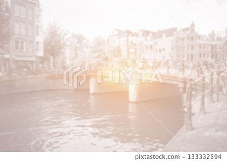 Amsterdam canal bridge with bright light and bicycles 133332594