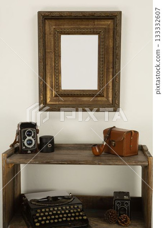 Empty photo frame on the wall 133332607