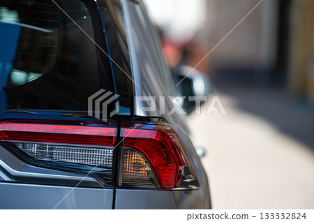 detail on the rear light of a car, close up of red taillight detail on the rear light of a car, close up of red taillight 133332824