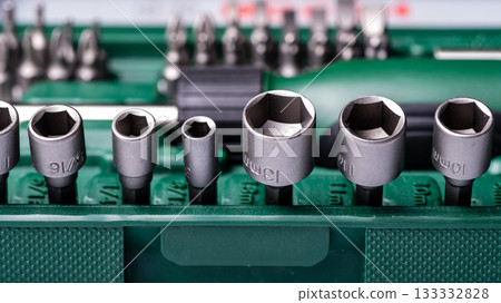 Interchangeable screwdriver set with different types of metal steel heads and bits, closeup Interchangeable screwdriver set with different types of metal steel heads and bits, closeup 133332828