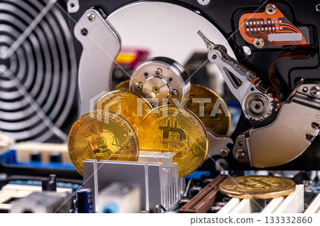 closeup of gold bitcoin on computer components background, technology and digital currency concept 133332860