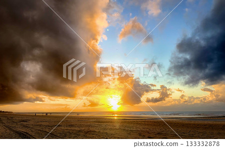 First light of day paints serene ocean sands with soothing hues 133332878