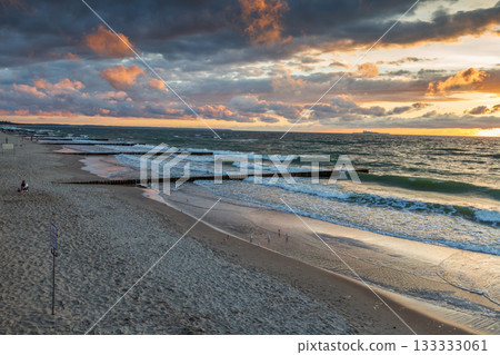 Russia, Zelenogradsk - July 26, 2022: Curonian Spit wth Baltic sea coastline on sunset 133333061