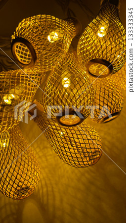 Warm golden string lights with a beautiful metallic mesh texture creating a cozy and festive atmosphere Warm golden string lights with a beautiful metallic mesh texture creating a cozy and festive atmosphere 133333345