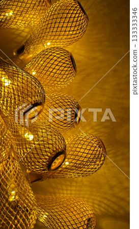 Warm golden string lights with a beautiful metallic mesh texture creating a cozy and festive atmosphere 133333346