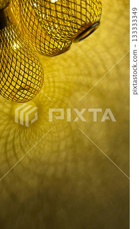 Warm golden string lights with a beautiful metallic mesh texture creating a cozy and festive atmosphere Warm golden string lights with a beautiful metallic mesh texture creating a cozy and festive atmosphere 133333349