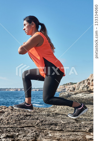 young fitness woman runner running on beach young fitness woman runner running on beach 133334060