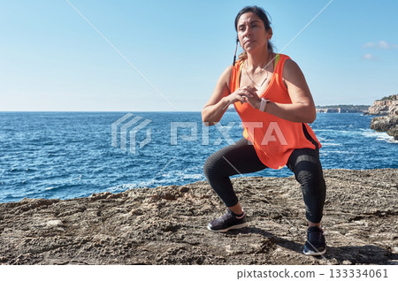 young woman doing yoga on the beach young woman doing yoga on the beach 133334061