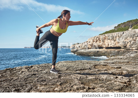 young woman doing yoga on the beach young woman doing yoga on the beach 133334065