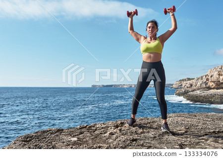 young woman doing yoga on the beach young woman doing yoga on the beach 133334076