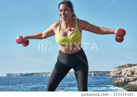 young woman doing sport in fitness center 133334101