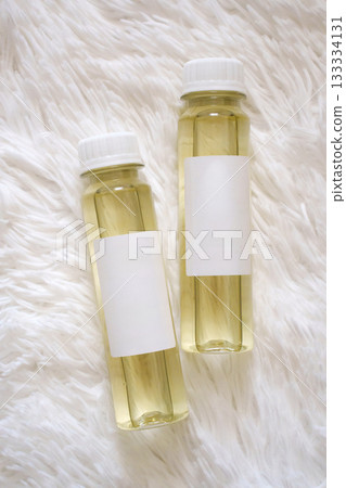 Essential oils for aroma diffuser placed on soft, fluffy surface 133334131
