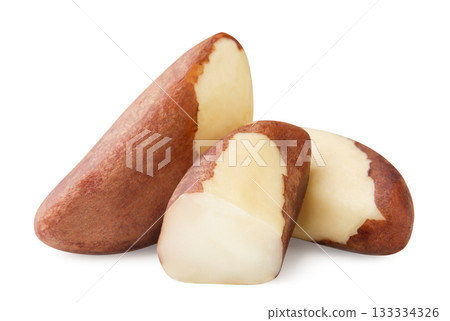 Brazil nuts and a half close-up on a white. Isolated 133334326