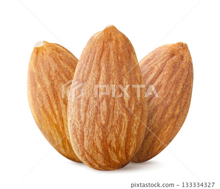 Three almonds nuts close-up on a white. Isolated 133334327