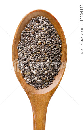 Chia seeds in a wooden spoon isolated on a white. Top view Chia seeds in a wooden spoon isolated on a white. Top view 133334331