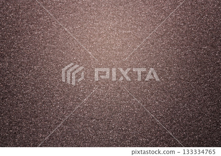 Brown glitter textured paper showing gleaming particles, suitable for festive, celebration, or luxurious concepts 133334765
