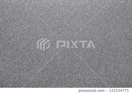 Silver glitter creating textured, shimmering surface. Background offering sparkling, abstract and metallic feel for design 133334771