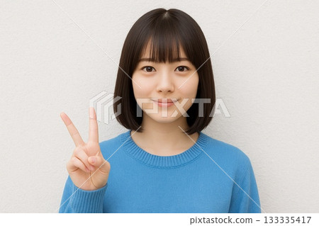 Woman with bob haircut in front of white wall 11 Woman with bob haircut in front of white wall 11 133335417