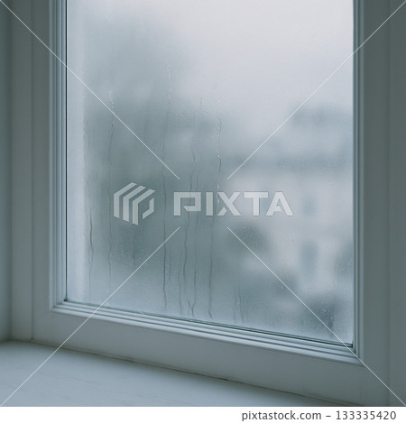 A quiet window with the city visible through the frosted glass 133335420