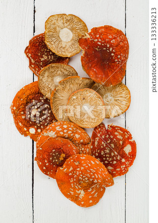 Dried fly agaric on a white background. 133336213