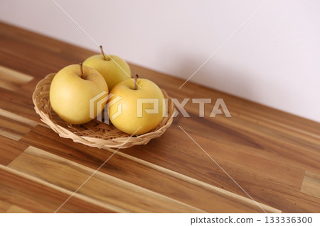 Yellow apples in a basket Yellow apples in a basket 133336300