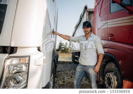 Opening the door. Truck driver is near the transport outdoors 133336959