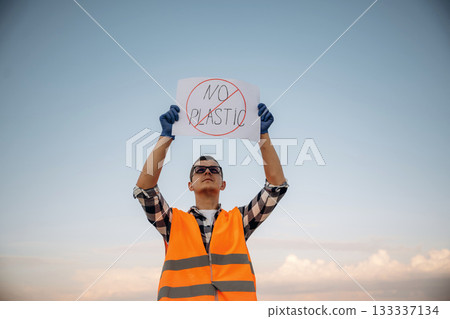 Man volunteer is against trash pollution outdoors 133337134