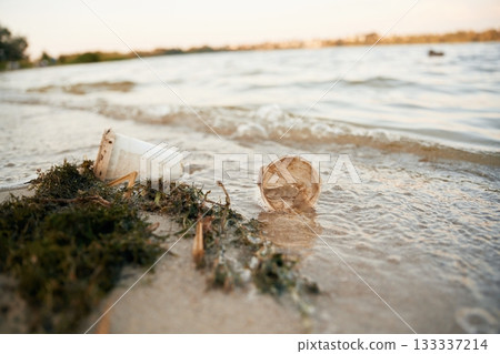 Trash on the shore, conception of the ecology and Earth day Trash on the shore, conception of the ecology and Earth day 133337214