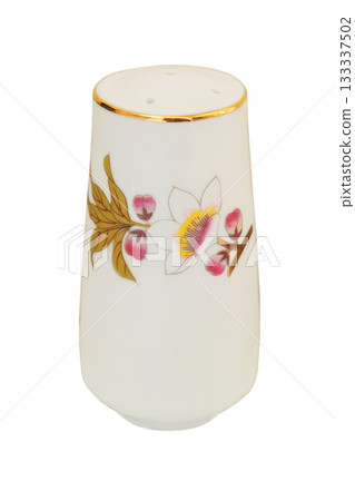 Ceramic salt shaker with a pattern of birdie isolated on a white background. Porcelain tableware. Ceramic salt shaker with a pattern of birdie isolated on a white background. Porcelain tableware. 133337502