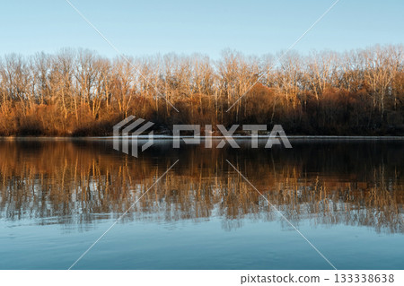 Golden Trees Reflected in Winter River Golden Trees Reflected in Winter River 133338638