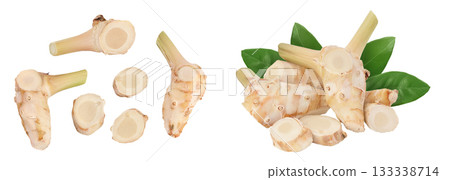 Fresh galangal root with slices isolated on white background with full depth of field. Top view. Flat lay Fresh galangal root with slices isolated on white background with full depth of field. Top view. Flat lay 133338714
