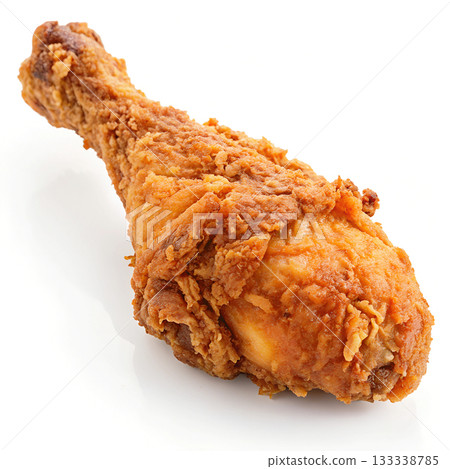 Crispy golden brown fried chicken drumstick on a pure white background 133338785