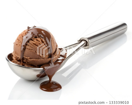 Chocolate ice cream scoop with melted chocolate sauce dripping down dessert 133339010