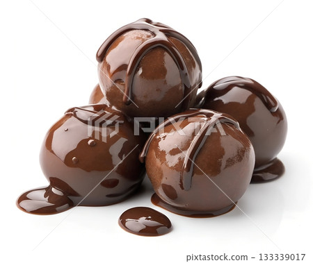 A pile of rich chocolate truffles generously drizzled with melted dark chocolate sauce 133339017