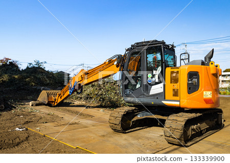 Heavy equipment backhoe at a forest logging construction site 133339900