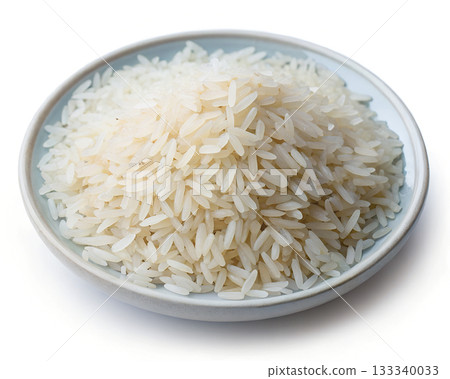 A bowl of uncooked white rice grains with a light blue rim isolated on a white background A bowl of uncooked white rice grains with a light blue rim isolated on a white background 133340033